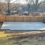 Concrete slab in place for a metal structure base