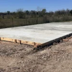 Concrete pad laid for building support