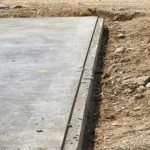 Smooth concrete slab foundation for building