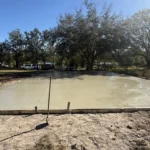 concrete slab finishing touches being put in place