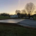 freshly installed concrete slab for residential metal building