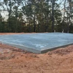 Flat concrete slab foundation for building