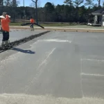 Concrete slab being smoothed for an even surface