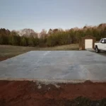 Concrete slab for a metal building foundation