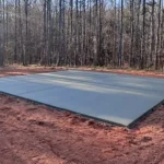 Concrete slab installation for a metal building foundation