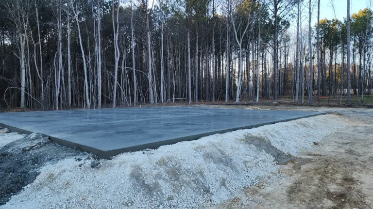 Freshly poured concrete slab drying on construction site
